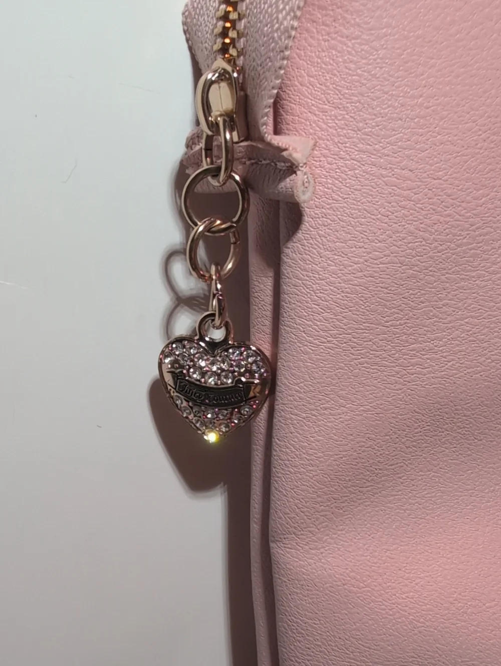 Juicy Couture Light Pink Vegan Leather Clutch Bag With Gold Hardware.